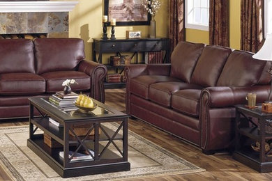 Inspiration for a mid-sized timeless formal and open concept medium tone wood floor and brown floor living room remodel in Baltimore with yellow walls, a standard fireplace, a tile fireplace and no tv