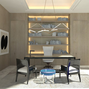 Expansive modern home office and library in Miami with a reading nook, grey walls, marble flooring, no fireplace, a freestanding desk and white floors.