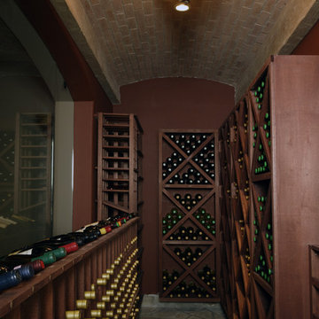 Wine Cellar with Barrel Vaulted Brick and Beam Ceiling