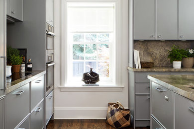 Eat-in kitchen - small traditional galley medium tone wood floor eat-in kitchen idea in Toronto with gray cabinets, marble countertops, gray backsplash, stone slab backsplash, stainless steel appliances, an undermount sink, beaded inset cabinets and an island