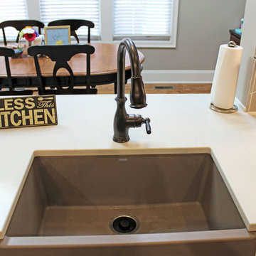 White Kitchen with Espresso Island and Eternia Caringdale Quartz Countertop