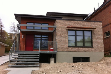 Entryway - mid-sized modern entryway idea in Salt Lake City with a red front door