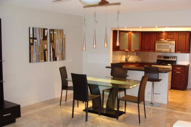 Inspiration for a large kitchen/dining combo in Miami with white walls and no fireplace.