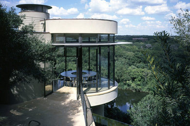 Enclosed dining room - large contemporary beige floor enclosed dining room idea in Austin with no fireplace