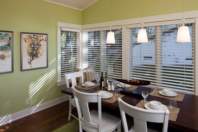 Mid-sized transitional brown floor and medium tone wood floor dining room photo in Chicago with green walls and no fireplace