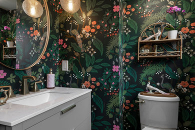 Inspiration for a small pink tile and ceramic tile ceramic tile, pink floor and single-sink bathroom remodel in Cleveland with flat-panel cabinets, gray cabinets, an undermount sink, quartz countertops and a built-in vanity