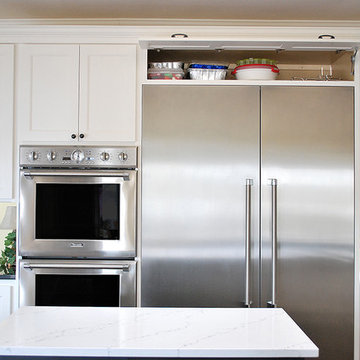 Cabinet door above refrigerator open