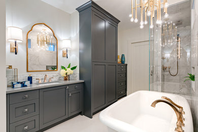 Mid-sized trendy master gray tile and mosaic tile porcelain tile and white floor bathroom photo in Calgary with gray cabinets, gray walls, an undermount sink, quartz countertops, shaker cabinets and a hinged shower door