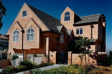 Inspiration for a large timeless pink three-story stucco exterior home remodel in San Francisco