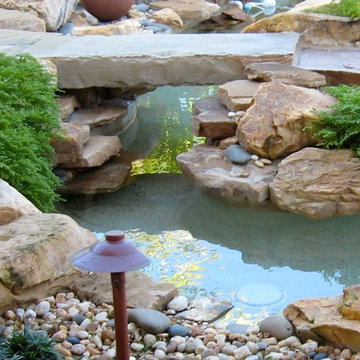 Backyard pond stone bridge