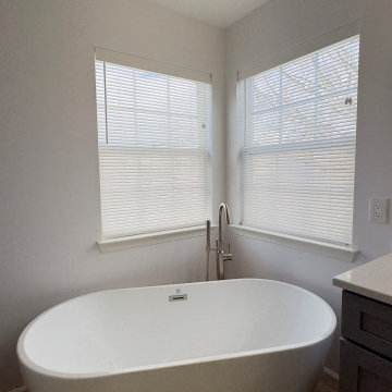 Spacious Bathroom with Dual Vanity and Freestanding Tub