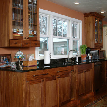 Copper Accented Craftsman Style Kitchen with Walnut Cabinets