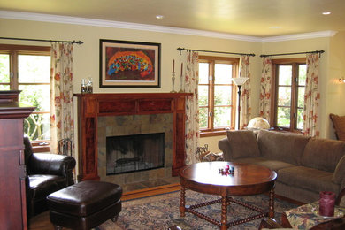 Inspiration for a craftsman living room remodel in San Diego with a wood fireplace surround
