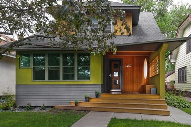 Photo of a small eclectic two-storey stucco green exterior in Minneapolis.