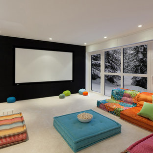 Trendy carpeted and beige floor home theater photo in Vancouver with white walls and a projector screen