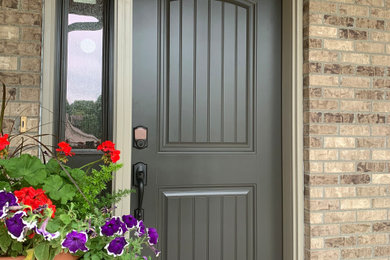 Entryway - traditional entryway idea in Other with a gray front door