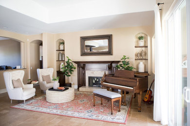 Mid-sized transitional open concept porcelain tile and beige floor family room photo in Orange County with a music area, beige walls, a standard fireplace, a wood fireplace surround and no tv
