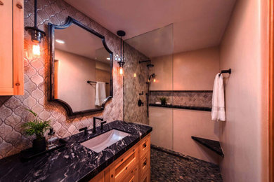 This is an example of a medium sized modern bathroom in Los Angeles with shaker cabinets, black cabinets, a shower/bath combination, beige walls, porcelain flooring, an open shower, beige worktops, a single sink and a freestanding vanity unit.