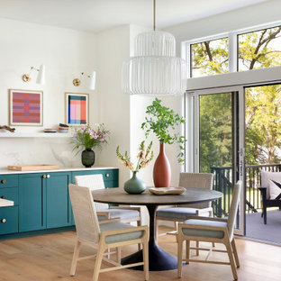 Great room - mid-sized coastal light wood floor and brown floor great room idea in Minneapolis with white walls