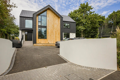 Design ideas for a large modern house exterior in Berkshire.