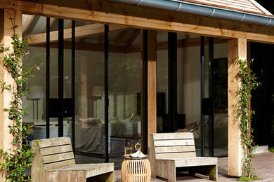 Example of a trendy deck design in Other with a bbq area