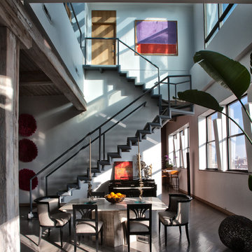 Loft with 2 story staircase and dining room