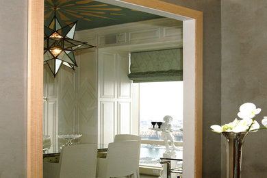 Enclosed dining room - mid-sized contemporary enclosed dining room idea in New York with white walls and no fireplace