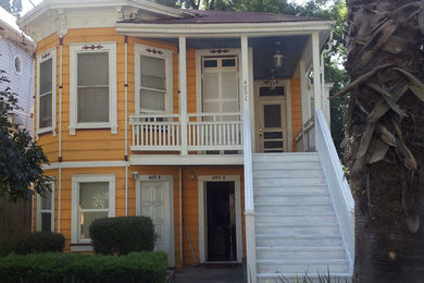 Yellow two-story exterior home photo in Sacramento