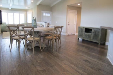 Mid-sized traditional open plan dining in Orange County with beige walls, light hardwood floors and no fireplace.