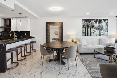 Small trendy ceramic tile and multicolored floor dining room photo in Other with white walls