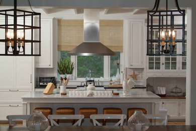 Inspiration for a large coastal galley dark wood floor eat-in kitchen remodel in Miami with a farmhouse sink, shaker cabinets, white cabinets, soapstone countertops, gray backsplash, stainless steel appliances and an island