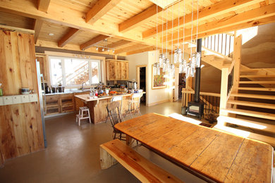 Inspiration for a large craftsman l-shaped concrete floor eat-in kitchen remodel in Ottawa with a double-bowl sink, beaded inset cabinets, light wood cabinets, stainless steel countertops, gray backsplash, stone tile backsplash, stainless steel appliances and an island