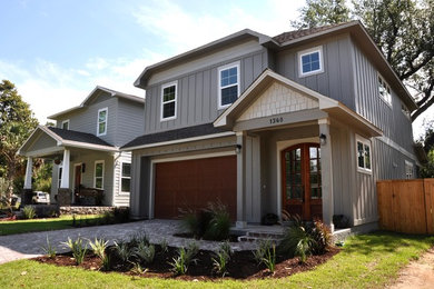 Large traditional gray two-story vinyl house exterior idea in Miami with a gambrel roof and a shingle roof