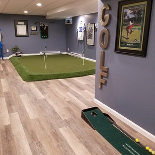 Inspiration for a large modern fully buried basement in Bridgeport with purple walls and light hardwood flooring.