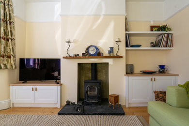Design ideas for a small traditional living room in Other with a wood burning stove.
