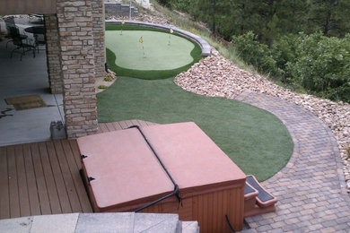 Design ideas for a mid-sized traditional drought-tolerant and full sun backyard concrete paver landscaping in Denver.