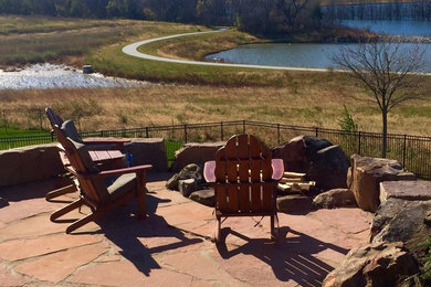 Large minimalist backyard patio photo in Omaha