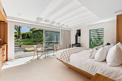 Design ideas for a transitional bedroom in Sydney.
