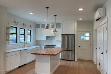 Mid-sized arts and crafts kitchen photo in Other with white cabinets