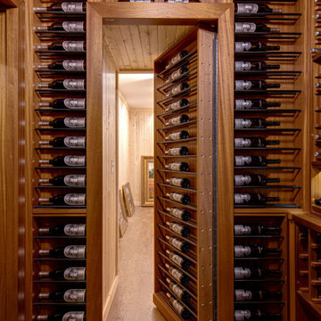 Secret passageway wine cellar. Basement layout with all mahogany racking.