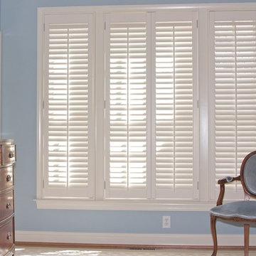Traditional plantation shutters with 2 1/2" louvers installed in the master bedr