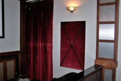 This is an example of a traditional home theatre in Orlando with red walls.