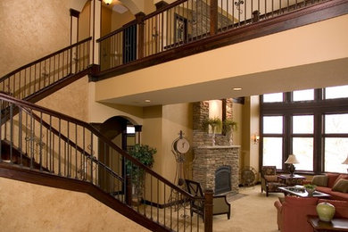 Foyer - huge contemporary ceramic tile foyer idea in Minneapolis with beige walls
