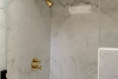 Example of a mid-sized minimalist master white tile and marble tile light wood floor shower bench design in Orange County with white walls, marble countertops, a hinged shower door and white countertops