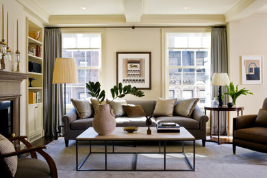 Living room - mid-sized transitional open concept dark wood floor and brown floor living room idea in New York with beige walls, a standard fireplace and a stone fireplace