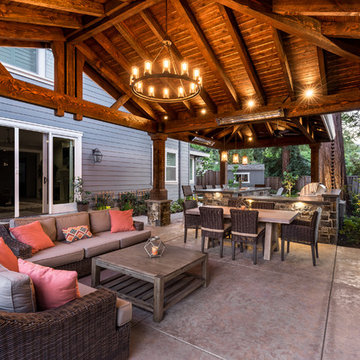 a Loggia with an Outdoor Kitchen and Living Room