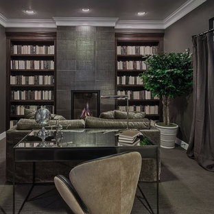 Inspiration for a medium sized modern study in Denver with grey walls, carpet, a standard fireplace, a tiled fireplace surround and a freestanding desk.
