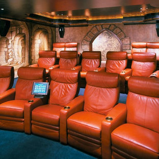 This is an example of an expansive mediterranean fully buried basement in Atlanta with multi-coloured walls, carpet, no fireplace and blue floors.