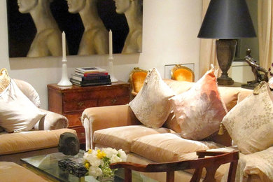Example of a mid-sized classic light wood floor and brown floor living room design in New York with white walls and no tv