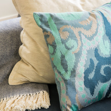 Layered Textures on Blue Upholstered Sofa